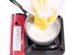 Add butter to the milk in the saucepan membuat kue muffin Royalty Free Stock Photo